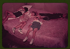 Children asleep on bed during square dance, McIntosh County, Okla. (LOC)